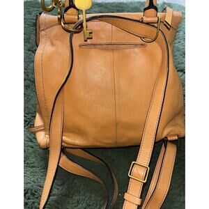 Fossil Parker style woman's brown leather backpack with key charm everyday bag